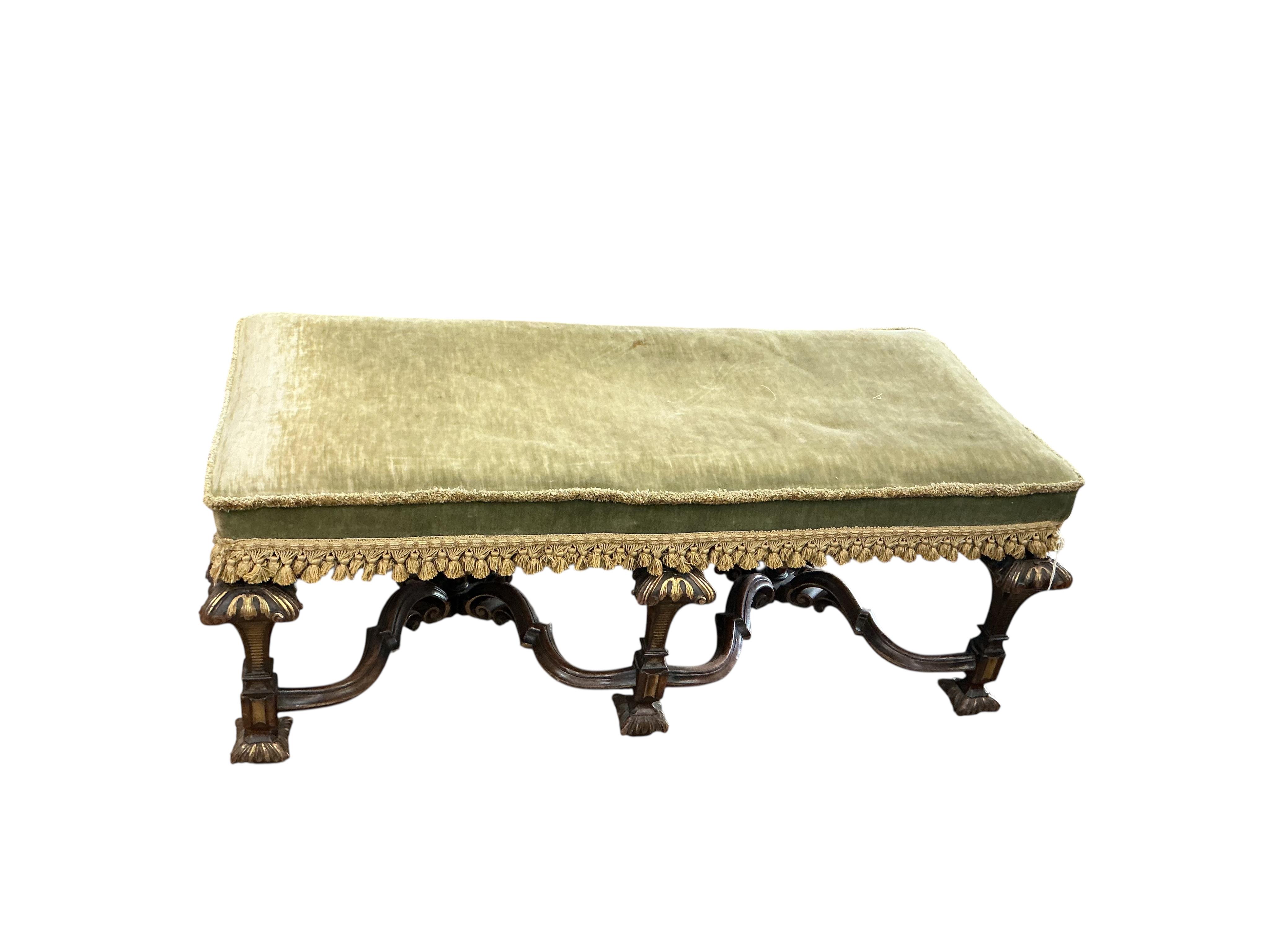 An 18th century style upholstered parcel gilt walnut stool, width 110cm, depth 48cm, height 44cm